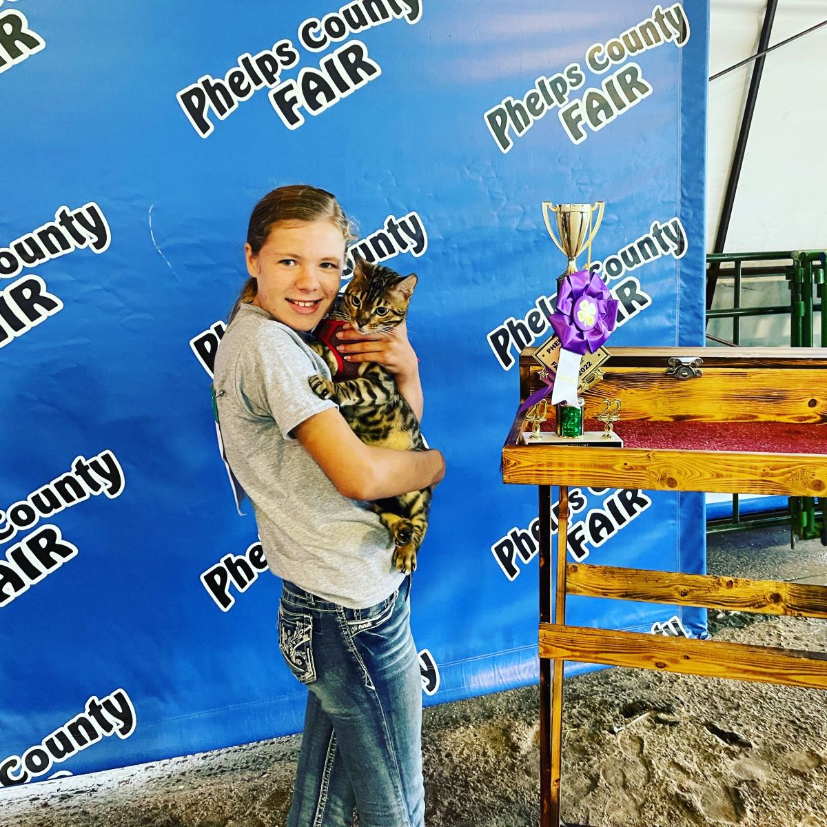 Emma Kroll shows offer her 4-H cat project