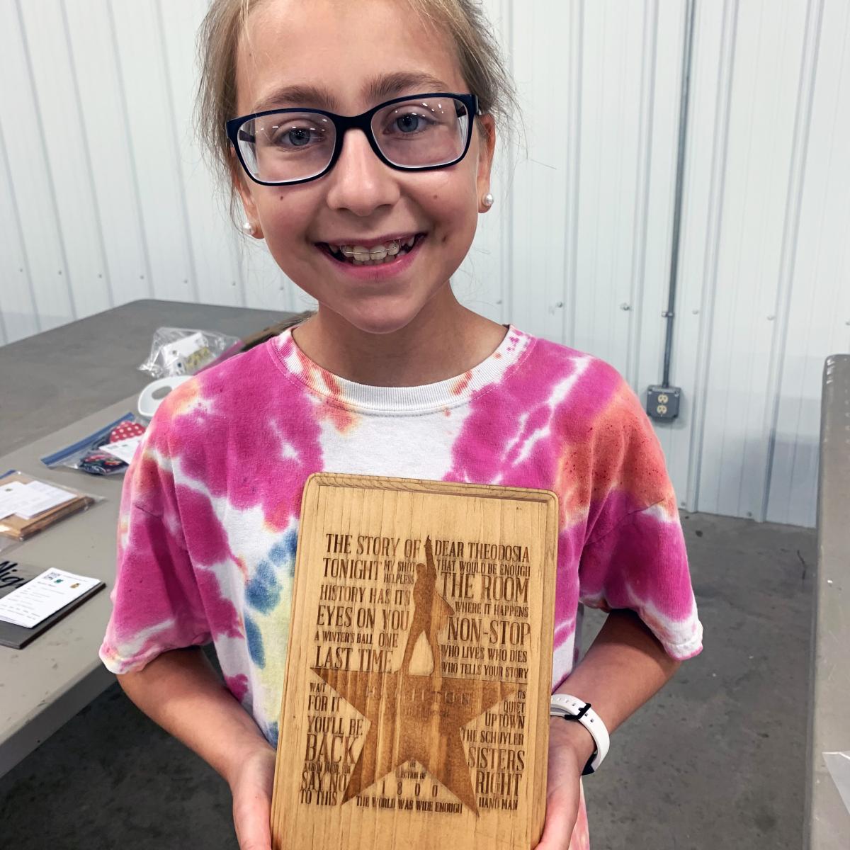 Megan Macklin shows off the shirt she made for her 4-H home environment project