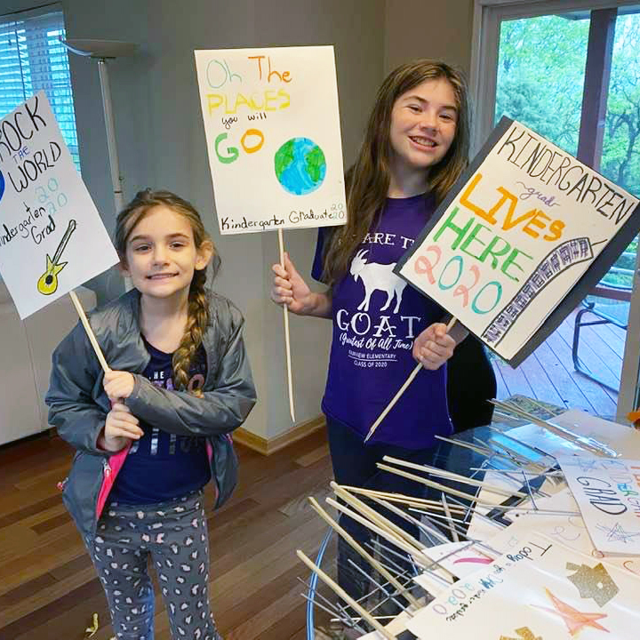 Joslyn and Maggie Stamp made and delivered signs to the homes of kindergartners to help them celebrate their graduation