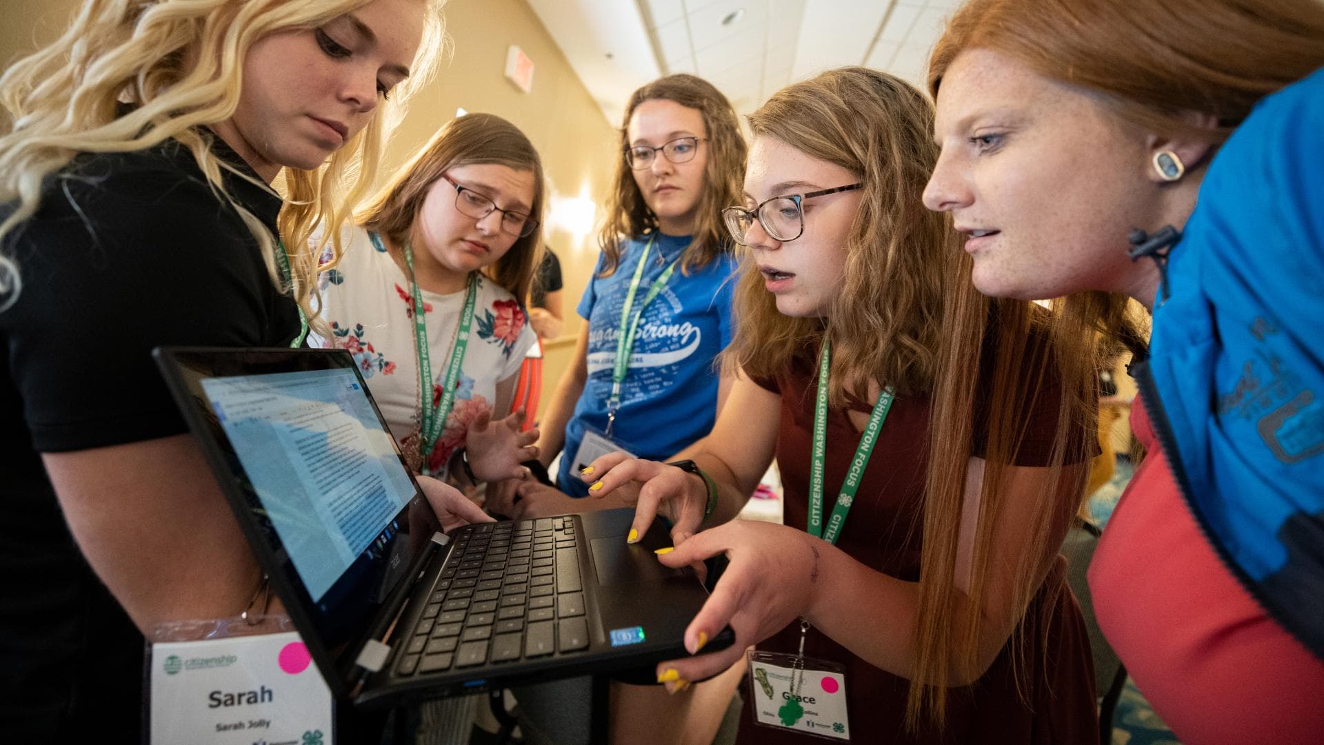 Youth working together on computers