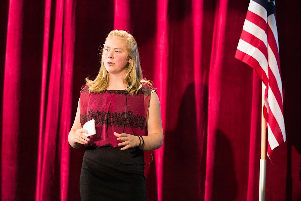 Youth participating in public speaking at the National Conference